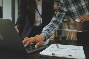 Audit concept,Administrator business man financial inspector and secretary making report calculating balance. Internal Revenue Service checking document. photo