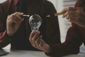 Inspiration. hand hold light bulb for good idea. brainstorming creative idea. photo