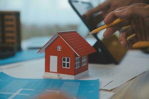 Construction and structure concept of Engineer or architect meeting for project working with partner and engineering tools on model building and blueprint in working site, contract for both companies. photo