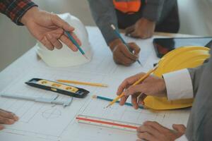 Construction and structure concept of Engineer or architect meeting for project working with partner and engineering tools on model building and blueprint in working site, contract for both companies. photo