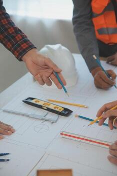 Construction and structure concept of Engineer or architect meeting for project working with partner and engineering tools on model building and blueprint in working site, contract for both companies. photo