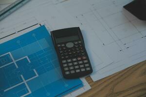Construction and structure concept of Engineer or architect meeting for project working with partner and engineering tools on model building and blueprint in working site, contract for both companies. photo