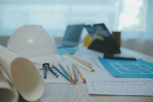 Construction and structure concept of Engineer or architect meeting for project working with partner and engineering tools on model building and blueprint in working site, contract for both companies. photo