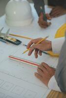 Construction and structure concept of Engineer or architect meeting for project working with partner and engineering tools on model building and blueprint in working site, contract for both companies. photo