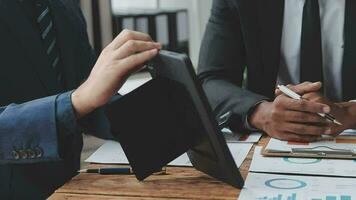 Team of business people working together in the meeting room office, teamwork background charts and graphs banner, double exposure successful teamwork,business planning concept. video