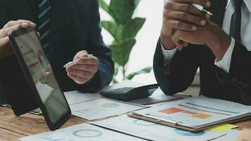 Team of business people working together in the meeting room office, teamwork background charts and graphs banner, double exposure successful teamwork,business planning concept. video