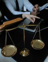 Male lawyer working with contract papers and wooden gavel on tabel in courtroom. justice and law ,attorney, court judge, concept. photo