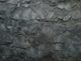 The surface of the old gray stone. Background, texture for design. Dark grey stone wall background texture. Natural pattern of black slate. AI Generative photo