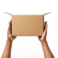 Female hands holding a brown cardboard box. photo