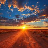 Sunset over a dirt road in the desert of Namibia. AI generated photo