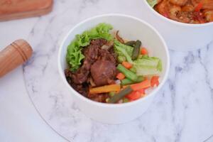 Thai food, Thai style mixed vegetable salad with beef. photo