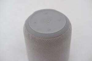 Wireless speaker on a white background. Close-up of speaker. photo