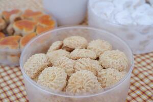 Coconut cookies in plastic cups, closeup of photo. photo