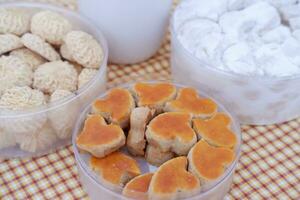 Coconut cookies in plastic cups, closeup of photo. photo