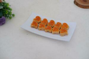 sweetmeat made from coconut milk and sugar photo