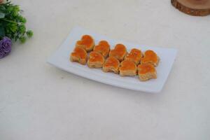 sweetmeat made from coconut milk and sugar photo