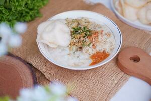 Rice porridge with chicken, indonesian style food photo