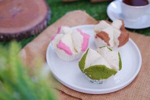 Bolu kukus is an Indonesian traditional sponge cupcake photo