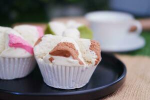 Bolu kukus is an Indonesian traditional sponge cupcake photo