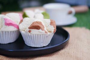 Bolu kukus is an Indonesian traditional sponge cupcake photo