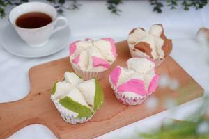 Bolu kukus is an Indonesian traditional sponge cupcake photo