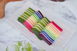 Kue Lapis or or Rainbow sticky layer cake, Indonesian traditional dessert photo