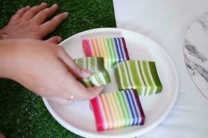 Kue Lapis or or Rainbow sticky layer cake, Indonesian traditional dessert photo