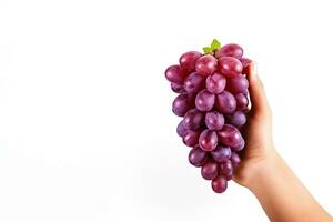 Hand holding a bunch of red grapes isolated on a white background with copy space. ai generated photo