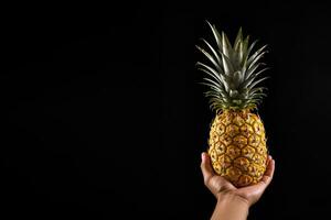 Hand hold fresh pineapple isolated on a black background with copy space. ai generated photo