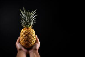 Hand hold fresh pineapple isolated on a black background with copy space. ai generated photo