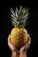 Hand hold fresh pineapple isolated on a black background. ai generated photo