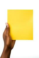 A human hand holding a blank sheet of yellow paper or card isolated on white background. ai generated photo