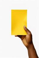 A human hand holding a blank sheet of yellow paper or card isolated on white background. ai generated photo