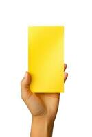 A human hand holding a blank sheet of yellow paper or card isolated on white background. ai generated photo