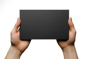 A human hand holding a blank sheet of black paper or card isolated on white background. ai generated photo