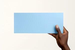 A human hand holding a blank sheet of blue paper or card isolated on white background. ai generated photo