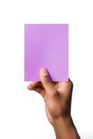 A human hand holding a blank sheet of purple paper or card isolated on a white background. ai generated photo