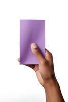 A human hand holding a blank sheet of purple paper or card isolated on a white background. ai generated photo