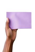 A human hand holding a blank sheet of purple paper or card isolated on a white background. ai generated photo