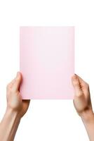 A human hand holding a blank sheet of pink paper or card isolated on a white background. ai generated photo