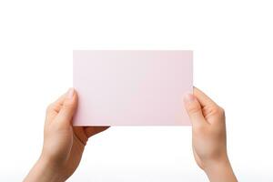 A human hand holding a blank sheet of pink paper or card isolated on a white background. ai generated photo