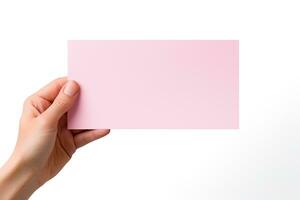 A human hand holding a blank sheet of pink paper or card isolated on a white background. ai generated photo