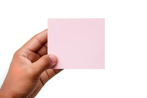 A human hand holding a blank sheet of pink paper or card isolated on a white background. ai generated photo