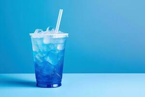 Blue drink in a plastic cup isolated on a blue background. Take away drinks concept with copy space. ai generated photo