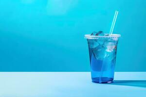 Blue drink in a plastic cup isolated on a blue background. Take away drinks concept with copy space. ai generated photo