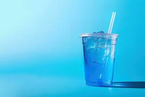 Blue drink in a plastic cup isolated on a blue background. Take away drinks concept with copy space. ai generated photo