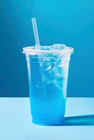 Blue drink in a plastic cup isolated on a blue background. Take away drinks concept. ai generated photo