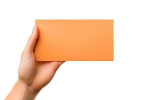 A human hand holding a blank sheet of orange paper or card isolated on a white background. ai generated photo