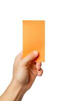 A human hand holding a blank sheet of orange paper or card isolated on a white background. ai generated photo