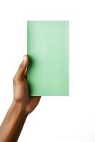 A human hand holding a blank sheet of green paper or card isolated on a white background. ai generated photo